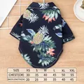 Summer Hawaiian style dog shirt featuring colorful pineapple and tropical leaf prints - Blue
