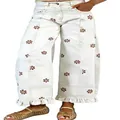 Detail of white floral print wide-leg jeans with vintage Y2K ruffled hem design. - White