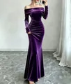 Full-body shot of an elegant purple velvet off-shoulder dress in a minimalist room - S / Dresses / Purple