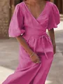 Elegant magenta wrap dress featuring puff sleeves and a waist tie detail close-up - Rose Red