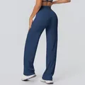 Rückansicht einer marineblauen Yoga-Schlaghose mit hoher Taille und weicher Textur - S / Unterteile / Marineblau