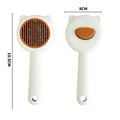 Self-cleaning pet grooming brush with cat ear design in white and orange finish - Cream