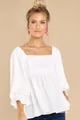 Close-up of white square-neck blouse with ruffled sleeves and lightweight fabric. - S / Tops / White