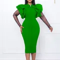 Dettaglio dell'abito verde elegante con spalle a balze e maniche in rete a pois - Taglia S / Vestiti / Verde