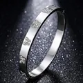 Silver-toned titanium steel bangle featuring four rhinestone-encrusted butterflies - Butterfly Style (48-E-1) / Silver