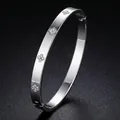 Elegant silver titanium steel bangle with rhinestone butterfly design for women. - Clover Style (16-E-5) / Silver