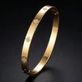 Elegant gold plated stainless steel bangle featuring sparkling diamond butterfly motifs - Clover Style (16-E-4) / Gold