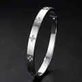 Elegant titanium steel bangle with diamond-set flower patterns and secure clasp. - Clover Style (52-D-7)