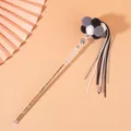 Detail of a luxury cat teaser wand featuring colorful beads, soft pom-poms, and long tassels - Black White Gray Balls With Black White Gray Tassels