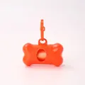 Bright orange bone-shaped dog waste bag dispenser with a portable hanging hook for pets - Orange