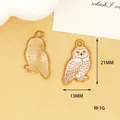 Detailed view of snowy owl charms showing dimensions of 21mm by 13mm and back texture - Owl