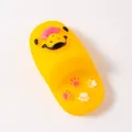 Close-up detail of durable yellow vinyl squeaky shoe toy for dogs with cute paw prints - Slipper Shape / Random Color