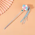 Pet cat teaser wand with colorful pompoms and blue-white tassels on beige background. - Pink Blue White Balls With Blue White Tassels