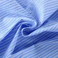 Gros plan d'un tissu à rayures bleues et blanches avec des détails en strass - S / Hauts / Bleu