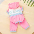 Detail view of a pink dog tracksuit with EXPLORE text print on the back - M / Pink