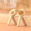 Cream-colored pet slicker brush with one-click hair removal button for cat grooming. - 1 Piece / Yellow