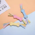 Set di tre giocattoli colorati da masticare per cani in TPR a forma di osso con code in tessuto - Osso Faccia di Maiale con Strisce di Tessuto