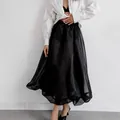 Elegante falda abullonada de malla negra en línea A con diseño francés y tela transparente - S / Bottoms / Negro