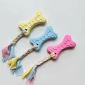 Giocattoli da masticare per cani in TPR a forma di osso con corde in tessuto intrecciato - Biscotto a Zampa con Striscia di Tessuto / Taglia unica
