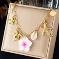Gold-plated stainless steel charm bracelet with starfish, turtle, and flower pendants. - Gold Turtle Sea Star Flower Artificial Pearl Multi Element (N4599)