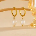 Macro view of gold-plated stainless steel hoop earrings with natural freshwater pearls. - Gold Freshwater Pearl Hoop Earrings (G210)