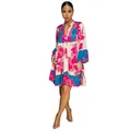 Detail view of the colorful floral print V-neck mini dress with bell sleeves - S / Dresses / Pink
