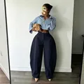 High-fashion navy wide-leg trousers with unique bulbous silhouette and pleated detail. - Blue