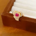 Detailed view of a 14k gold-plated flower ring with a red gemstone and zircons - Adjustable Open Design / Gold-Rose Red
