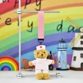 Close-up of nurse teddy bear plush toy hanging from a pink strap with cute props - Pink Nurse Brown Bear (Color Rope)