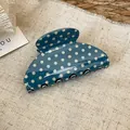 Detailed view of the dark blue polka dot pattern on a stylish acrylic hair claw clip. - Polka Dot Medium Curved Style (3#) / Blue