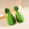 Elegant green acrylic teardrop earrings featuring a unique marbled resin pattern design - Stud Pin Style / Green