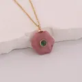 Close-up of hexagonal pink stone pendant with green gem on gold stainless chain - Pink Textured Style (2#) / Red Wood Grain