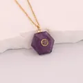 Detail view of a hexagonal purple amethyst stone pendant on a gold stainless steel chain - Purple Crystal