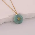 Close-up of hexagonal natural stone pendant on gold stainless steel chain - Amazonite