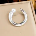 Elegant silver-colored stainless steel open circle brooch featuring a white pearl accent - C-Shaped Pearl Style (JBSW599) / Steel