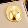 Minimalist gold-plated stainless steel brooch with a smooth polished mirror finish - Glossy Irregular Oval Style (JBSW600) / Gold