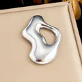 Silver-toned polished stainless steel brooch with an organic wavy hollow design - Irregular Streamlined Style (JBSW611)