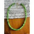 Close-up detail of handmade green abacus stone bead necklace with blue spacer beads. - Abacus Bead Necklace / 38+5cm / Orange and Green Patchwork