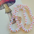 Close-up of natural stone abacus bead necklace with vibrant orange knotted cord detail - Abacus Bead Necklace with Orange Knot / 43cm / Milky White