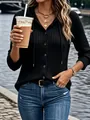 Detailed view of women's black ribbed long sleeve buttoned hoodie in a lifestyle setting - Black