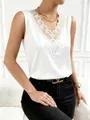 Detail of elegant white satin V-neck sleeveless top with intricate lace embroidery - S / Tops / White