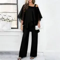Elegant black two-piece set featuring tiered off-shoulder top and matching wide-leg pants - S / Top And Bottom / Black