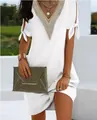 Detailed view of an elegant white summer dress with lace V-neck and split bow tie sleeves - White