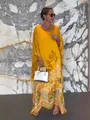 Loose yellow long sleeve printed kaftan maxi dress with round neck and floral patterns - S / Dresses / Yellow