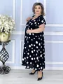 Full-length view of a plus-size summer dress featuring classic white polka dots on black - S / Dresses / Black