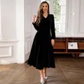 Elegant black gold velvet long-sleeved midi dress for women featuring a flared silhouette - S / Dresses / Black