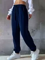 Detailed close-up of navy blue women's drawstring sweatpants featuring elasticated ankle cuffs - 3XL / Bottoms / Navy Blue
