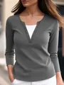 Close-up detail of women's charcoal grey faux two-piece top with embellished V-neck - S / Tops / Gray