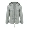 Front view of grey waterproof lightweight outdoor hooded jacket with drawstring details - S / Tops / Light Gray