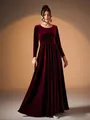 Elegant burgundy velvet long sleeve evening gown featuring a pleated waist and floor-length skirt - Burgundy